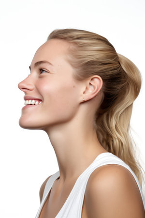 Portrait of a beautiful young woman with blond hair on white backgroundの素材