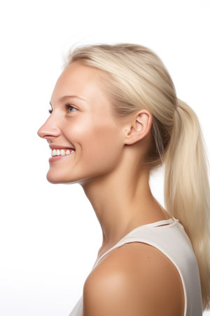 Portrait of a beautiful young blonde woman on a white background.の素材