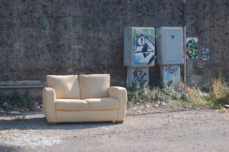 abandoned sofa in an illegal dumpの写真素材