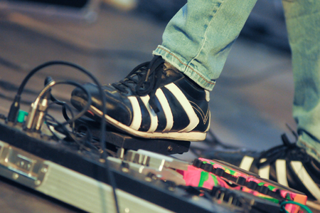 men who uses guitar effectsの写真素材