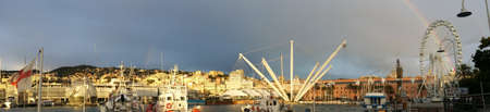 rainbow over the Old Port of Genoa In Italyの写真素材