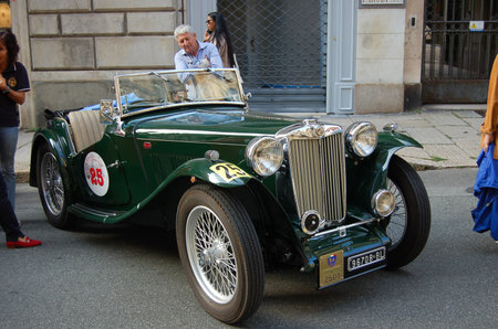 vintage car parked during a rally in the cityの写真素材