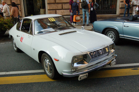 vintage car at a parade through the city streetsの写真素材