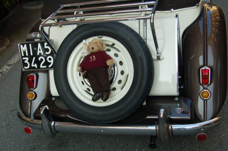 vintage car at a parade through the city streetsの写真素材