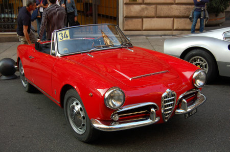 vintage car at a parade through the city streetsの写真素材