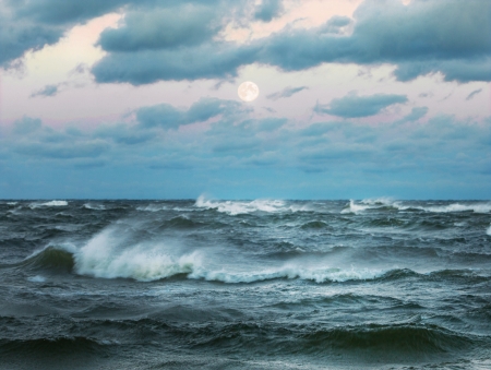 Stormy sea with beautiful moonの写真素材