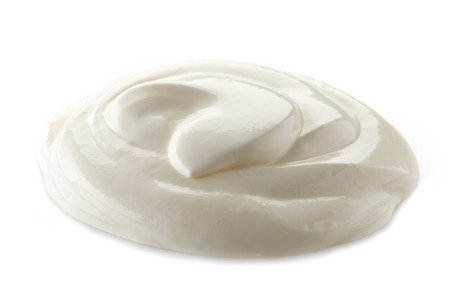 sour cream on a white backgroundの写真素材