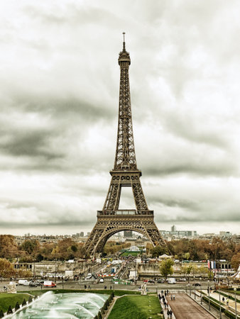 Paris, France-November 13, 2015: Paris cityscape with Eiffel tower in Paris, France. It is an iron tower named after engineer Gustave Eiffel, popular tourist attraction. Filtered imageのeditorial素材