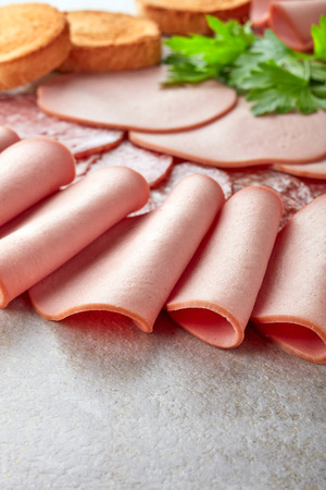 various sausage slices and toasted bread, selective focusの写真素材