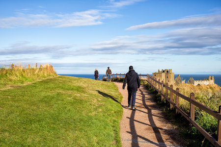 tourists going to see scottish Dunnotar Castle