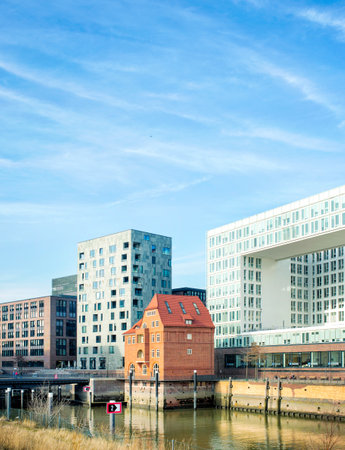 Hamburg, Germany - FEBRUARY 16, 2017: view of modern and old red brick buildings and city canalのeditorial素材