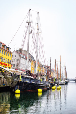 Copenhagen, Denmark - MARCH 30, 2017: Nyhavn is a 17th-century waterfront, canal and entertainment district in Copenhagen, Denmark.のeditorial素材