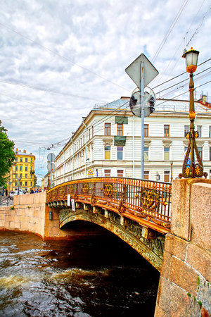 Saint Petersburg, Russia - JUNE 24, 2017: BOLSHOY KONYUSHENNY BRIDGE over the Moyka river. It is a small bridge decorated with great railings and lanternsのeditorial素材