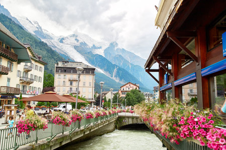 Chamonix, France - JULY 19, 2017: View of Arve river, buildings of Chamonix and Mont Blanc Massif,...