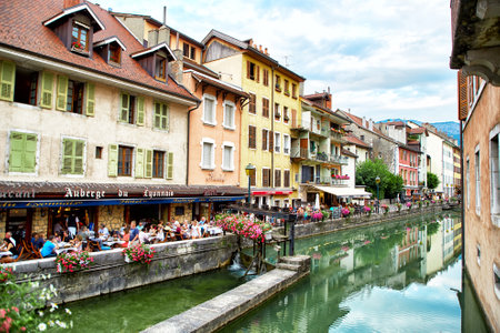 Annecy, France - JULY 19, 2017: People relaxing, walking, and eating around river Thiouのeditorial素材