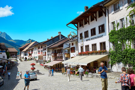 Gruyere, Switzerland - JULY 20, 2017: Street view of Old Town Gruyere, tourists walk around the townのeditorial素材