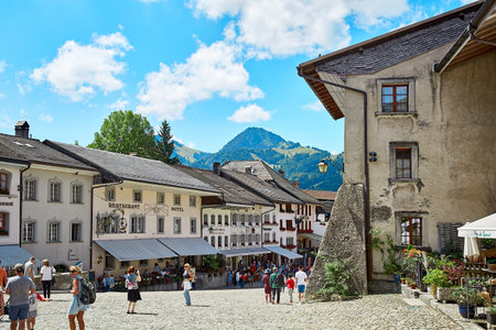 Gruyere, Switzerland - JULY 20, 2017: Street view of Old Town Gruyere, tourists walk around the townのeditorial素材
