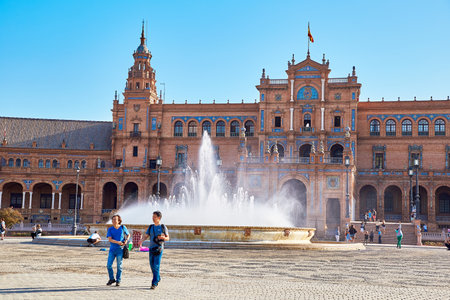 Sevilla, Spain - October 16, 2017: Fontain and tourists in Spain Square (Plaza de Espana), Sevilla