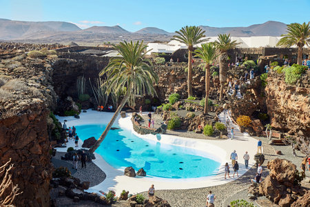 Lanzarote, Spain - DECEMBER 02, 2017: Tourists are walking and taking pictures in Jameos del Agua garden in Lanzarote, Canary Islands, Spainのeditorial素材