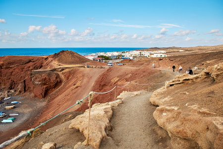 Lanzarote, Spain - DECEMBER 03, 2017: Tourists are walking along Atlantic ocean in Lanzarote island, Canariesのeditorial素材