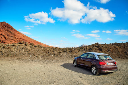 Lanzarote, Spain - DECEMBER 03, 2017: Rental car in Playa Montana Bermeja, Beautiful landscape of Lanzarote Island, Canaries, Spainのeditorial素材