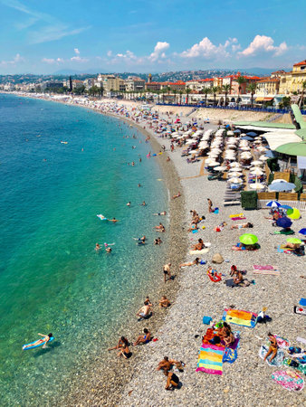 Nice, France - AUGUST 07, 2018: People are sunbathing and relaxing on Nice beach on a hot summer day, Franceのeditorial素材