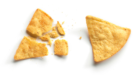 whole and broken corn chips nachos isolated on white background, top viewの写真素材