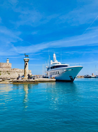 Rodos, Greece - MAY 12, 2019: Entrance to the Mandraki harbor,  Rhodes, Greeceのeditorial素材