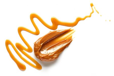 composition of caramel candies isolated on white background, top viewの写真素材