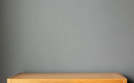 wooden shelf on grey wall backgroundの写真素材
