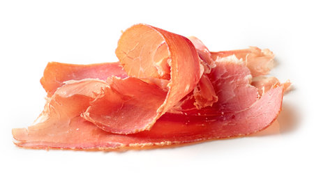 sliced spanish iberico ham isolated on white backgroundの写真素材