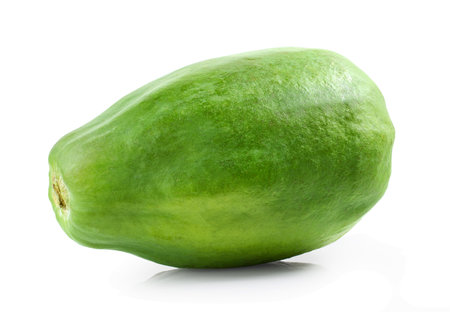 whole fresh green papaya fruit isolated on white backgroundの写真素材