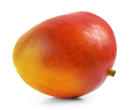 fresh ripe whole mango fruit isolated on white backgroundの写真素材