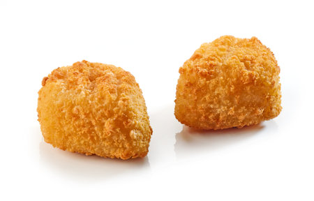 fried fish fillet nuggets isolated on white backgroundの写真素材