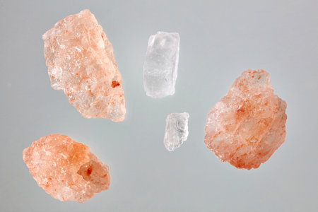 pink himalaya salt macro isolated on grey background, top viewの写真素材