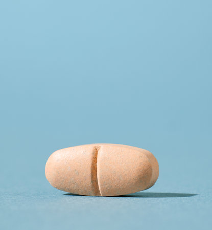 orange pill on blue background