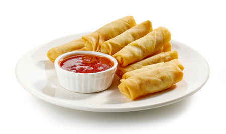 plate of fried springrolls on white backgroundの写真素材