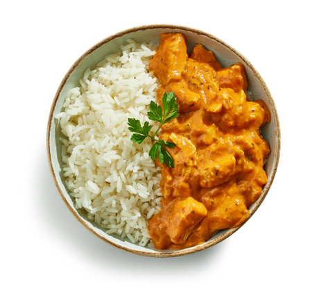 bowl of Chicken Tikka Masala with Rice isolated on white background, top viewの写真素材