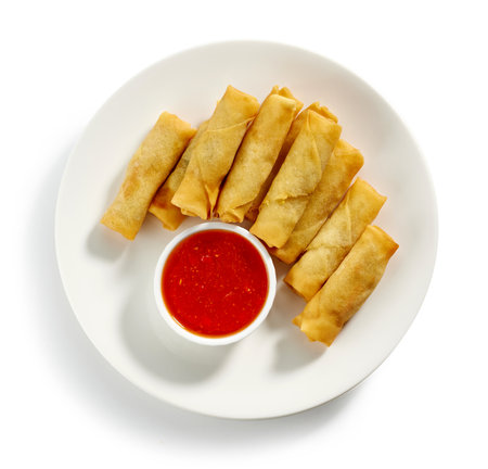 plate of fried spring rolls and sweet chili dip sauce isolated on white background, top viewの写真素材