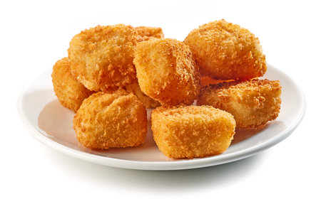 fried fish fillet nuggets isolated on white backgroundの写真素材