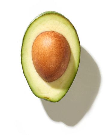 fresh halved avocado isolated on white background, top view