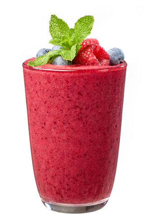 glass of fresh red banana and berries smoothie decorated with raspberries and blueberries and mint leafの写真素材