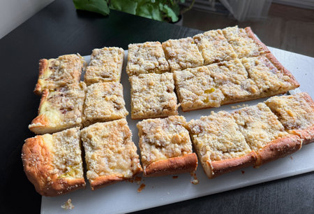 freshly baked homemade sweet bread with rhubarbs and crumbles on table