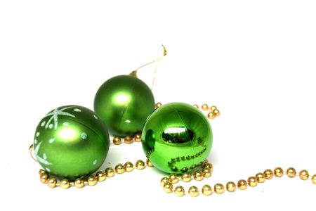 Christmas ball green with star motifs on a white and gold beads. 

の写真素材