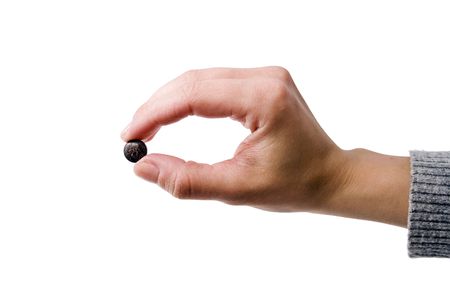 Female hand holding one gray pillの写真素材