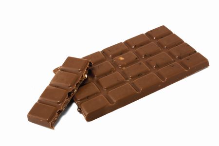 Milk chocolate with nuts isolated on whiteの写真素材