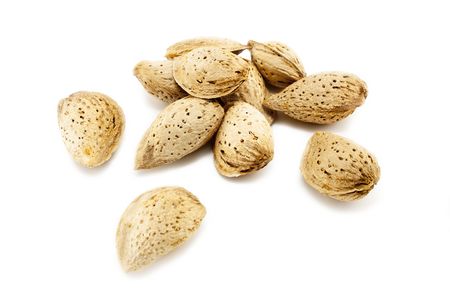 Pile of almonds isolated on white backgroundの写真素材