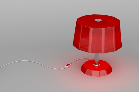 Red lamp illuminates on gray backgroundの写真素材