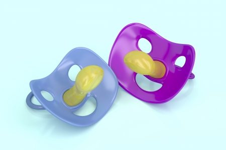 Blue and purple pacifiers, 3d rendered imageの写真素材