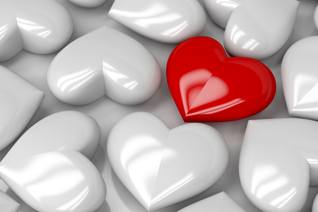 Concept image with one different colored heartの写真素材